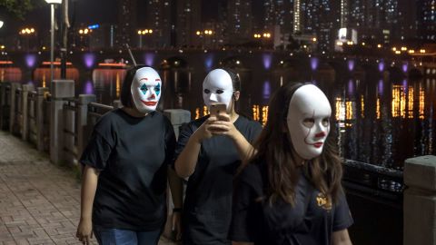 Hong Kong protesters wear a mask on October 18, 2019, in defiance of a government ban on face masks in public assemblies.