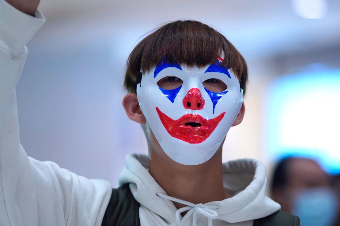 A protester wears a Joker mask during a protest in Hong Kong on October 18, 2019.