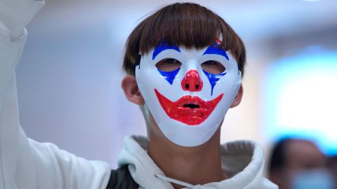 A protester wears a Joker mask during a protest in Hong Kong on October 18, 2019.