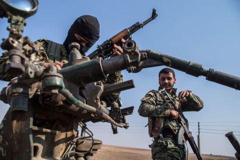 Kurdish forces withdraw from an area near the Turkish border with Syria on Sunday, October 27.