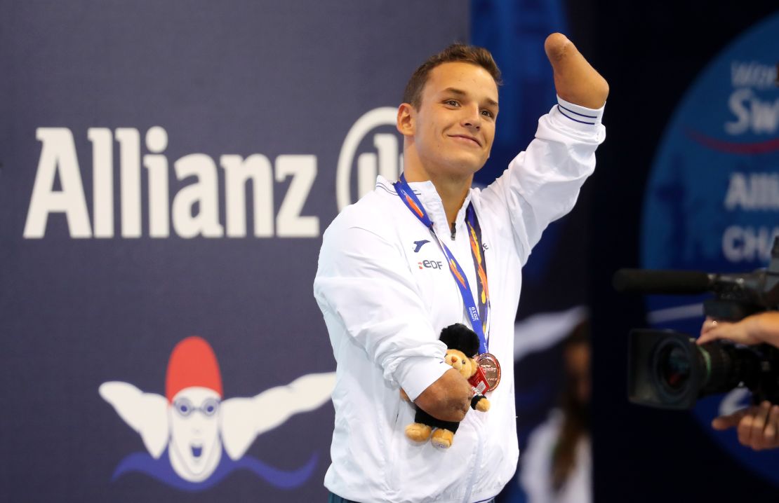 Théo Curin waves to the crowd as he celebrates winning a bronze medal in the Mens 200m Freestyle S5 Final on Day Two of the London 2019 World Para-swimming Championships.