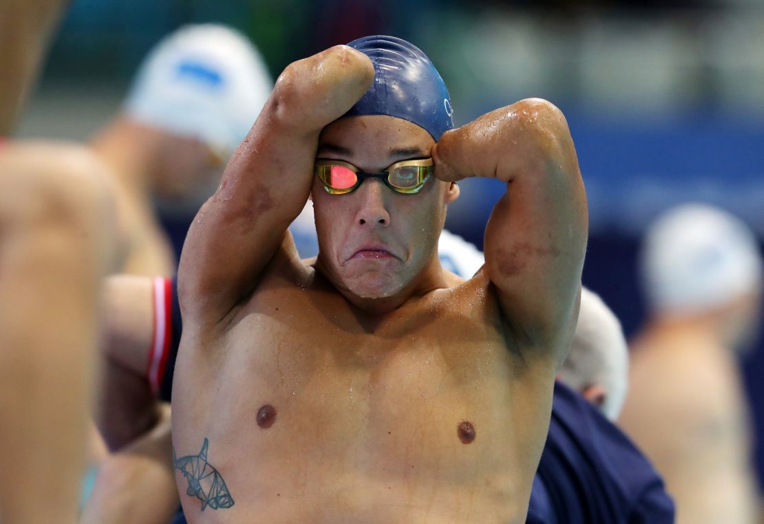 Théo Curin adjusts his cap and goggles as prepares for the Men's 50m Butterfly S5 heats on Day Four of the London 2019 World Para-swimmingChampionships.