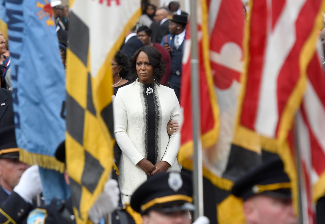 Cummings' wife, Maya Rockeymoore Cummings, watches pallbearers move the her husband's casket at the conclusion of his funeral service in Baltimore on Friday, October 25.