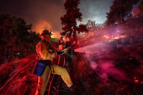 Firefighters work near the Getty Center in Los Angeles on Monday, October 28.