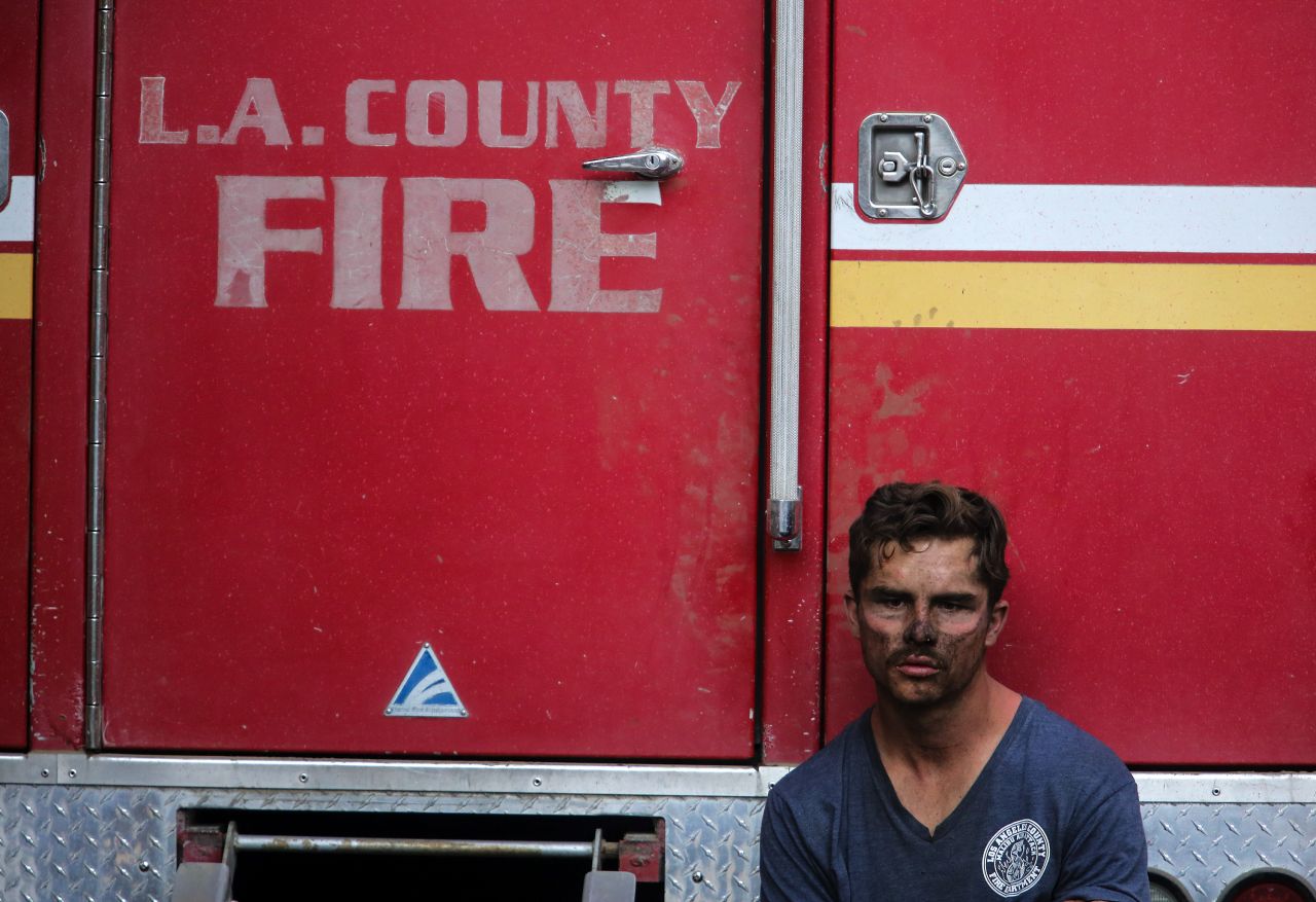Los Angeles County firefighter Collin Bashara rests near his truck on October 28.