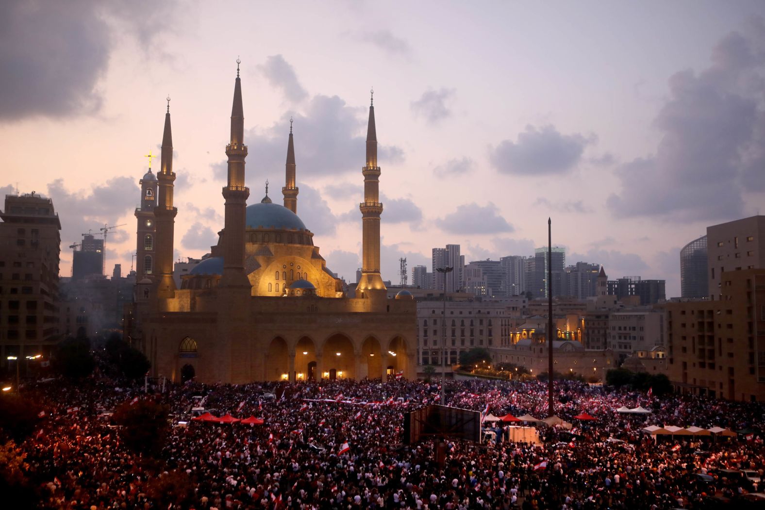 A rally takes place in Beirut outside the Mohammad al-Amin Mosque and the nearby Maronite Cathedral of St. George on Sunday, October 20.