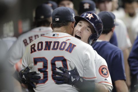 Bregman is congratulated in the dugout after hitting a home run in the first inning of Game 6.