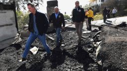 From left, California Governor Gavin Newsom, L.A. City Councilman Mike Bonin, and L.A. City Mayor Eric Garcetti tour a burned home along Tigertail Road in Brentwood, Calif., Tuesday Oct. 29, 2019. (Wally Skalij/Los Angeles Times via AP, Pool)