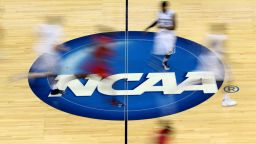 JACKSONVILLE, FL - MARCH 19:  Mississippi Rebels and Xavier Musketeers players run by the logo at mid-court during the second round of the 2015 NCAA Men's Basketball Tournament at Jacksonville Veterans Memorial Arena on March 19, 2015 in Jacksonville, Florida.  (Photo by Mike Ehrmann/Getty Images)