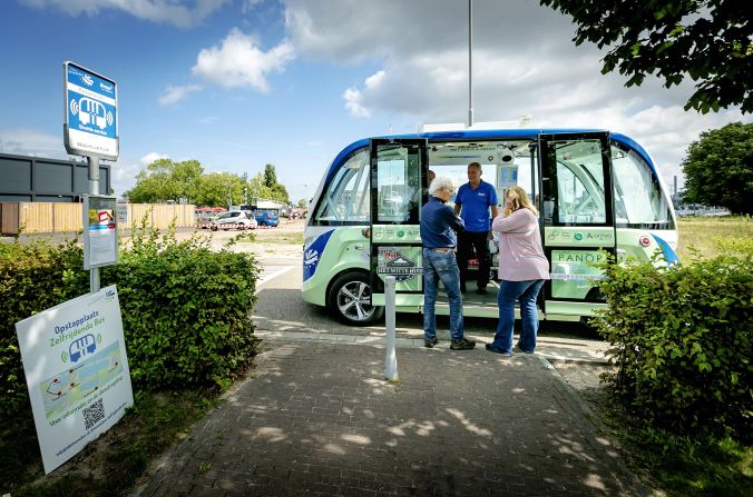 Passengers wait to embark on a self-driving shuttle bus in Drimmelen, the Netherlands - the country ranked No.1 in KPMG's Autonomous Vehicles Readiness Index.