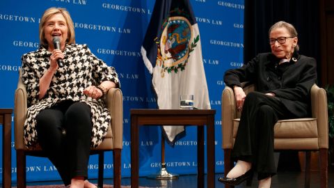 Supreme Court Justice Ruth Bader Ginsburg, right, listens as former Secretary of State Hillary Clinton speaks, Wednesday, Oct. 30, at Georgetown Law's second annual Ruth Bader Ginsburg Lecture, in Washington.