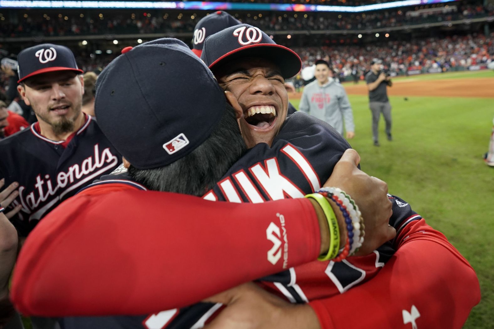 Nationals left fielder Juan Soto hugs catcher Kurt Suzuki during the postgame celebrations.