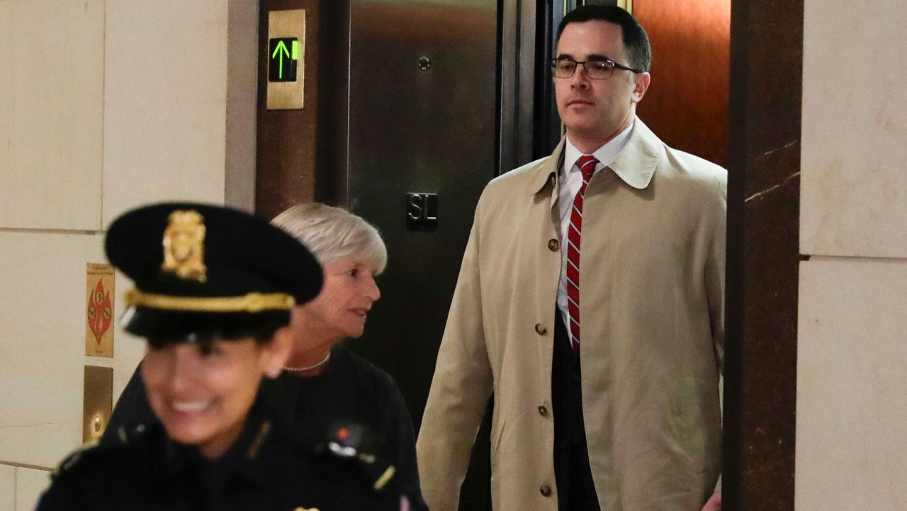 Former top national security adviser to President Donald Trump, Tim Morrison, right, arrives for a closed door meeting to testify as part of the House impeachment inquiry into President Donald Trump on Capitol Hill in Washington, Thursday, Oct. 31, 2019. (AP Photo/Pablo Martinez Monsivais)