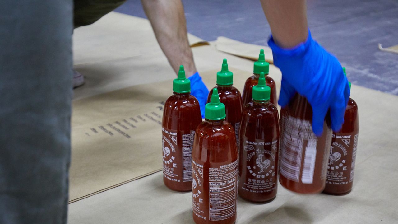 Australian police say they have found 400kg of methylamphetamine hidden in 768 bottles of Sriracha hot sauce.
