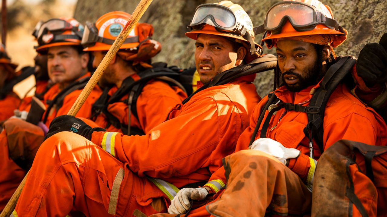 A crew of inmate firefighters takes a break from battling the Kincade Fire in Healdsburg, California.