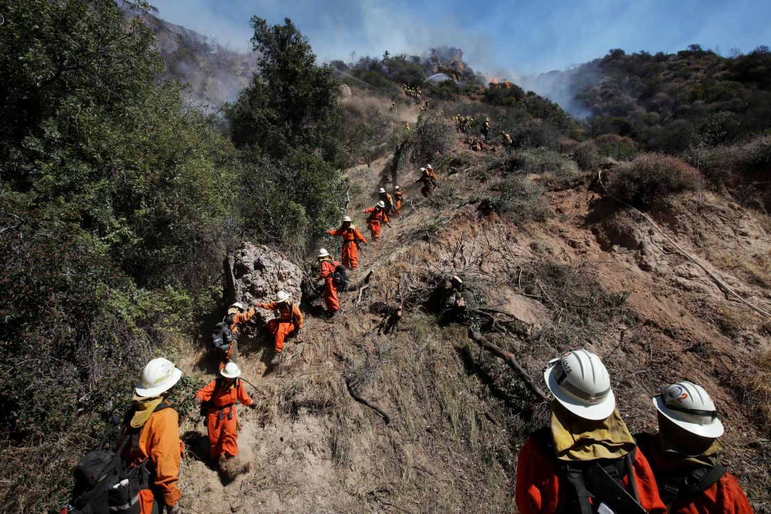 An inmate firefighter crew works in Los Angeles' Pacific Palisades neighborhood in October.