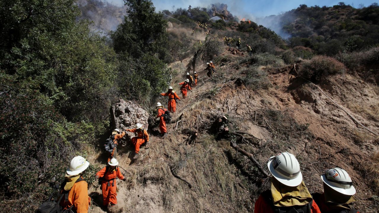 An inmate firefighter crew works in Los Angeles' Pacific Palisades neighborhood in October.