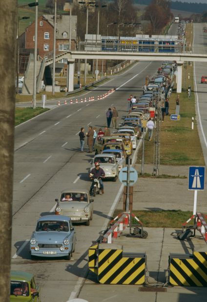 A line of East Germany's famous Trabant cars heads West along a highway near Leipzig, following the fall of the Wall.