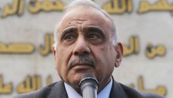 Iraq's Prime Minister Adel Abdel Mahdi speaks during a symbolic funeral ceremony in Baghdad on October 23, 2019 for Major General Ali al-Lami, a commander of the Iraqi Federal Police's Fourth Division, who was killed the previous day in Samarra in the province of Salahuddin, north of the Iraqi capital. - The police commander was killed in an ambush on October 22 which Iraqi security forces blamed on dormant cells of the Islamic State (IS) group. (Photo by AHMAD AL-RUBAYE / AFP) (Photo by AHMAD AL-RUBAYE/AFP via Getty Images)