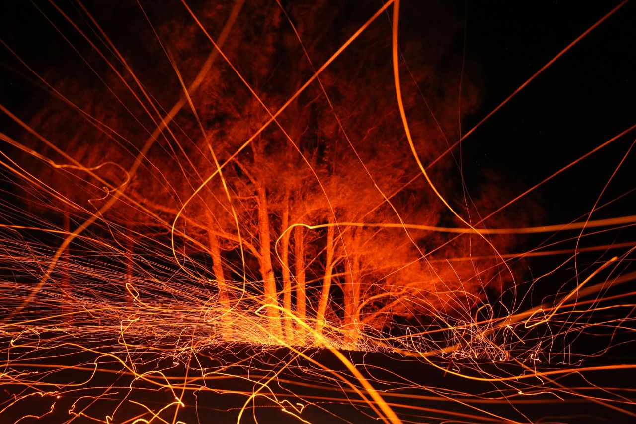 In this long-exposure photo, high winds blow hot embers from the Kincade Fire in Calistoga, California, on Tuesday, October 29. <a href="http://www.cnn.com/2019/10/25/weather/gallery/california-wildfires-2019/index.html" target="_blank">The wildfire</a> started October 23 and has burned nearly 77,000 acres in Northern California.