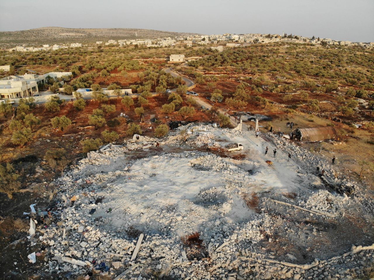 This aerial photo, taken on Sunday, October 27, shows <a href="https://www.cnn.com/videos/world/2019/10/27/al-baghdadi-raid-aftermath-compound-nr-npw-pkg-vpx.cnn/video/playlists/around-the-world/" target="_blank">the wreckage left behind</a> by the US military raid that killed ISIS leader Abu Bakr al-Baghdadi.