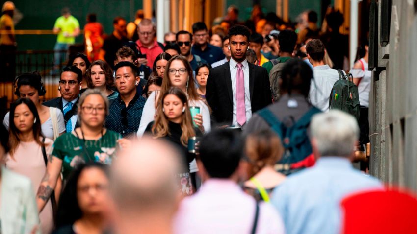 People commute to work at Wall Street in lower Manhattan on August 1, 2019 in New York City. (Photo by Johannes EISELE / AFP)        (Photo credit should read JOHANNES EISELE/AFP/Getty Images)