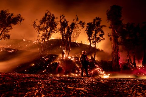 A firefighter works at containing the Maria Fire in the hills near Ventura, California, on November 1.