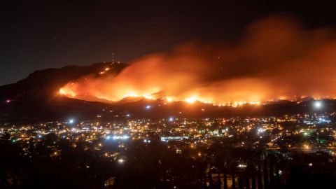 A long-exposure photo shows the Maria Fire as it races across a hillside in Santa Paula, California, on November 1.