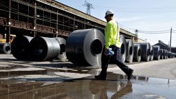 A worker walks past steel coils at the U.S. Steel Corp. Granite City Works facility in Granite City, Illinois, U.S., on Thursday, July 26, 2018. U.S. President Donald Trump celebrated U.S. Steel Corp's decision to re-employ hundreds of laid-off workers and lamented decades of past leaders' trade policies. Photographer: Daniel Acker/Bloomberg via Getty Images