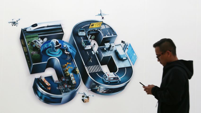 BEIJING, CHINA - OCTOBER 31: A man walks past a 5G sign on the opening day of PT Expo China 2019 at the China National Convention Center on October 31, 2019 in Beijing, China. China officially kicked off commercialization of 5G services on Thursday. China Mobile, China Unicom and China Telecom unveiled their monthly 5G plans with prices ranging from 128 yuan (about 18 U.S. dollars) to 599 yuan (about 85 U.S. dollars). (Photo by VCG/VCG via Getty Images)