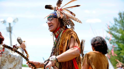 Performers make their way around the dance circle during the Spring Planting Moon Pow Wow in Marshfield, Massachusetts, in May 2019.