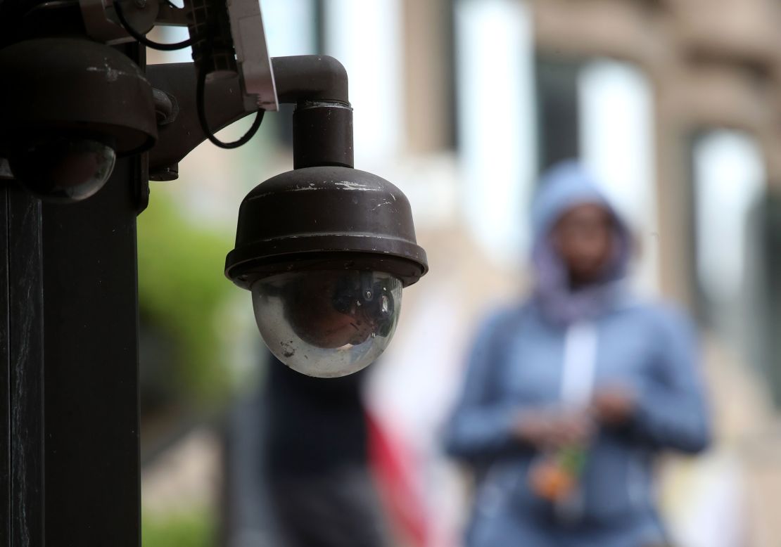 A video surveillance camera hangs from the side of a building on May 14, 2019 in San Francisco, California.