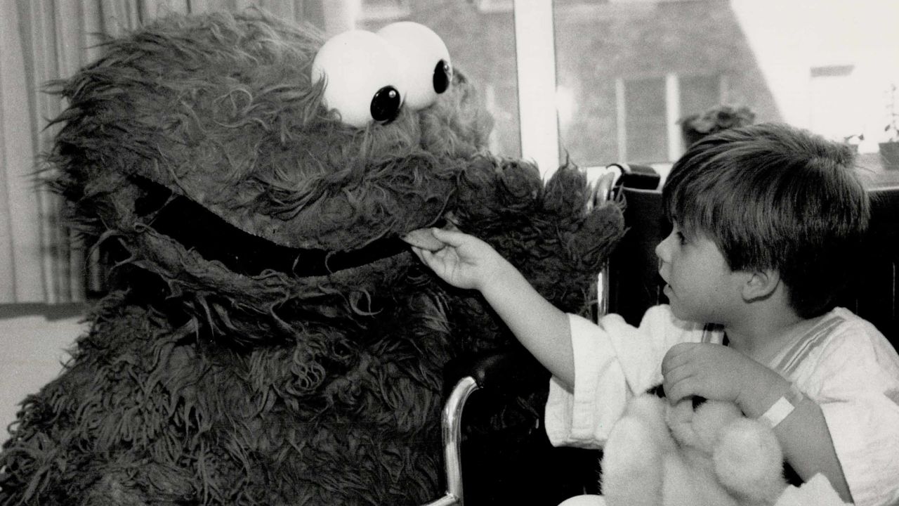 A life-sized Cookie Monster visited children in the hospital. He might not share cookies, but he's got joy to spare.