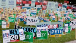 Election signs of the various democratic candidates are planted at the Polk County Democrats Steak Fry, in Des Moines, Iowa, in September 2019.