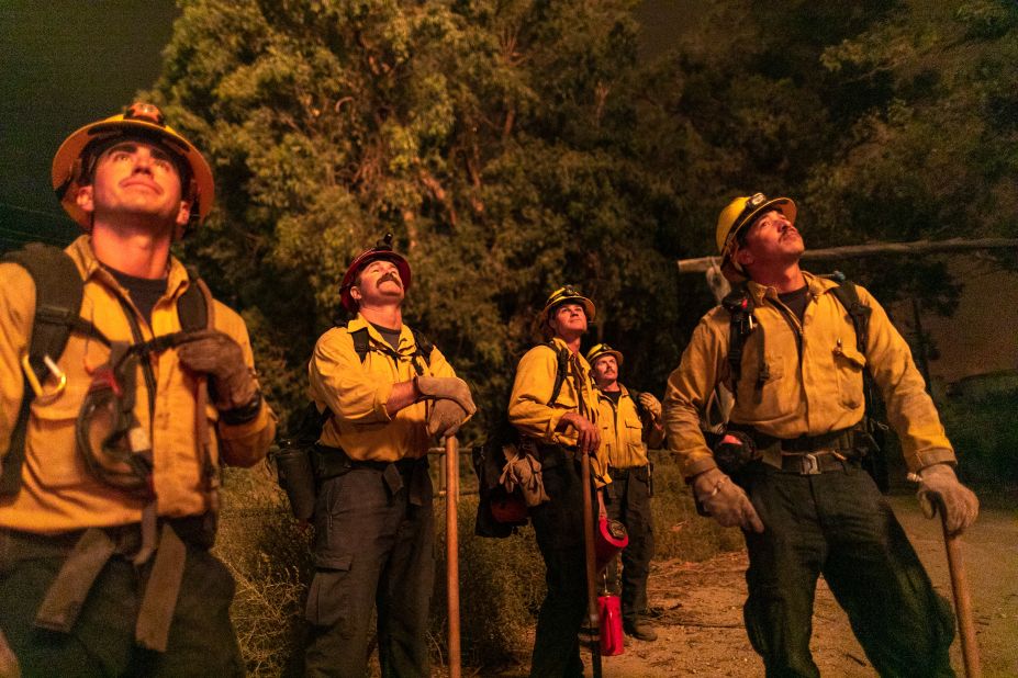 Firefighters watch the progress of a backfire near Somis.