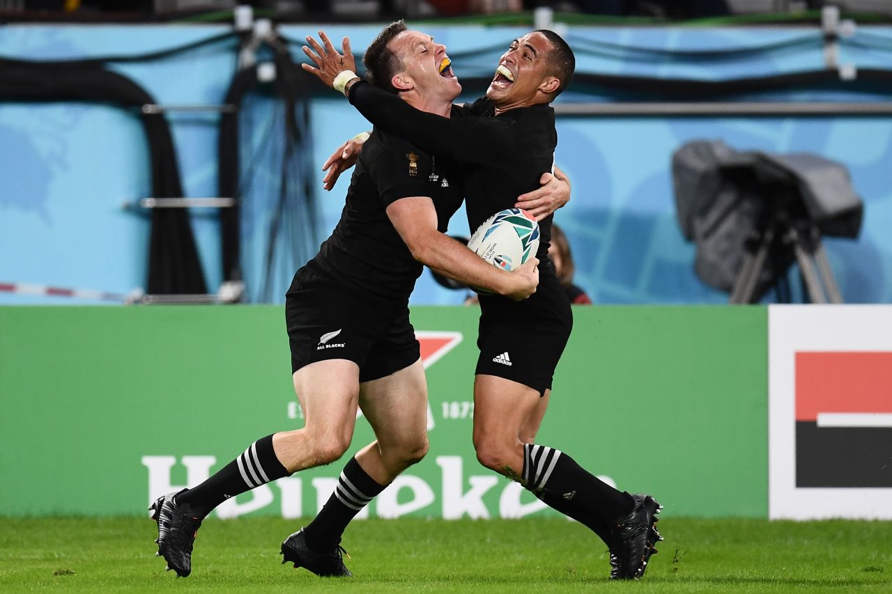 New Zealand's wing Ben Smith (L)  celebrates with scrumhalf Aaron Smith after scoring a try  during the Japan 2019 Rugby World Cup bronze final match against Wales. The All Blacks ran out comfortable 40-17 winners.