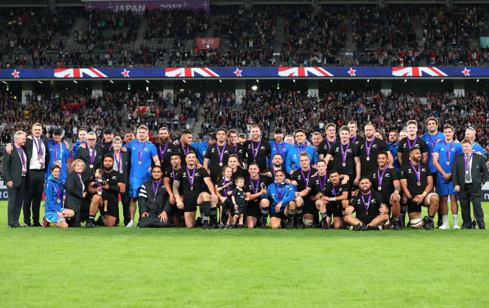 The All Blacks celebrate their bronze medal success.