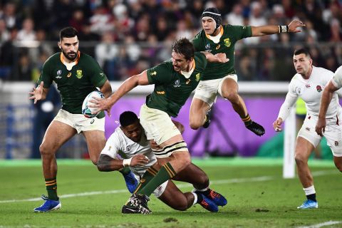 South Africa's lock Eben Etzebeth (C) passes the ball to South Africa's centre Damian De Allende (L). The win over England gave the Springboks their third World Cup title.