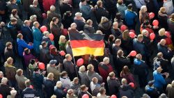 People take part in a rally of PEGIDA (Patriotic Europeans against the Islamization of the West) in Dresden, Germany, Sunday, Oct.21, 2018. (AP Photo/Jens Meyer)
