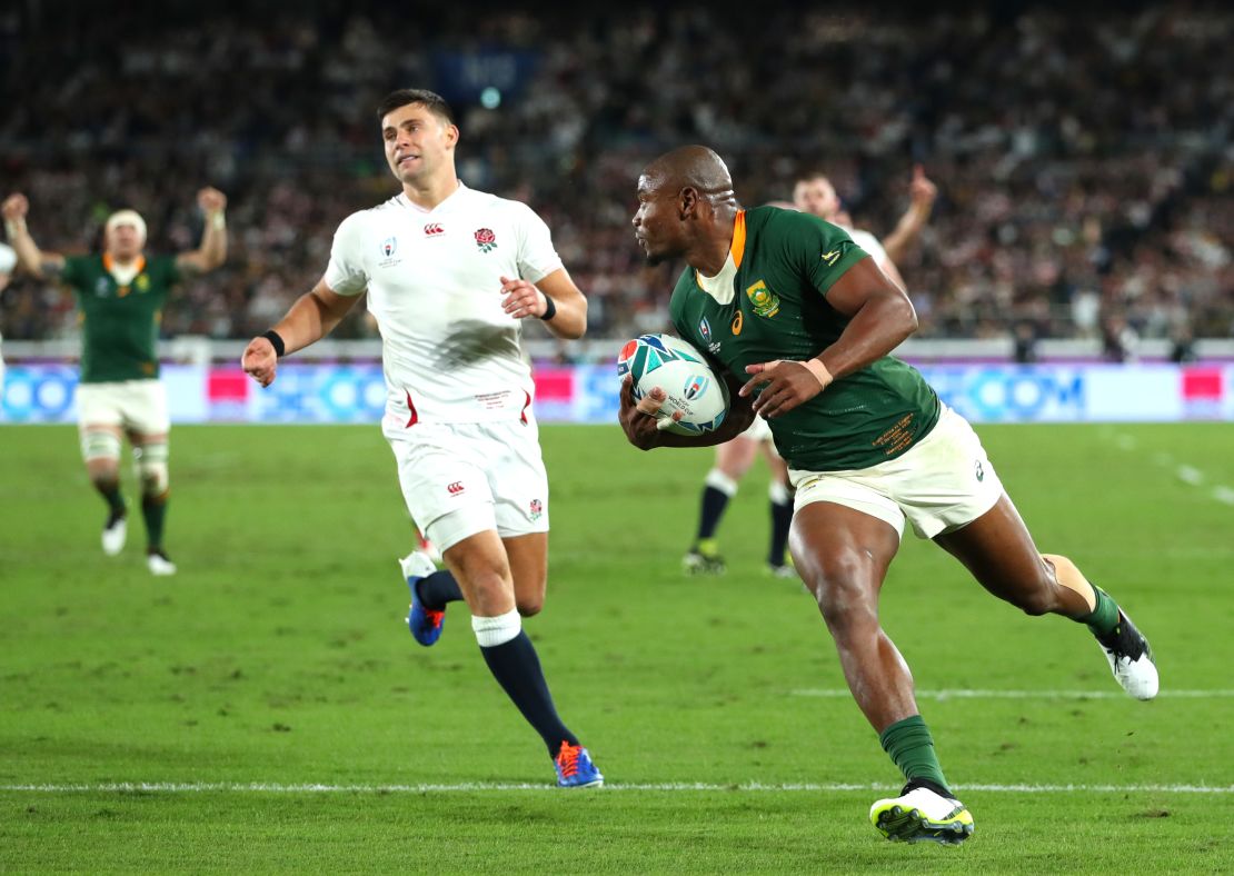 Makazole Mapimpi of South Africa breaks through to score his team's first try during the Rugby World Cup final.