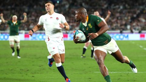 Makazole Mapimpi of South Africa breaks through to score his team's first try during the Rugby World Cup final.
