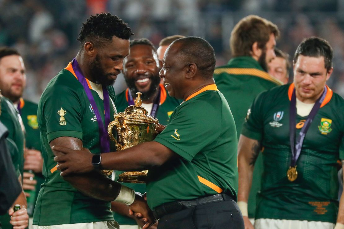South Africa's President Cyril Ramaphosa congratulates South Africa's captain Siya Kolisi as they celebrate winning the  2019 Rugby World Cup final.