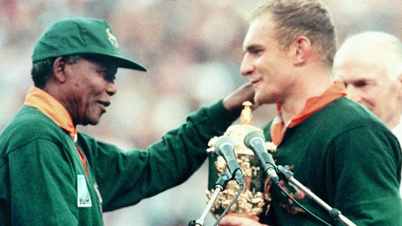 Former South African President Nelson Mandela hands over the Webb Ellis Cup to Springbok skipper François Pienaar in 1995 after his side won the Rugby World Cup and inspired a nation.