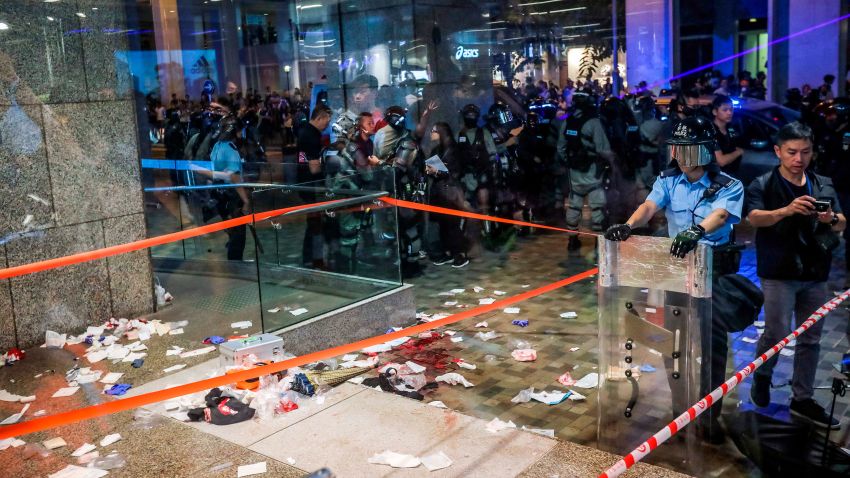 Blood and debris are seen on the ground at the entrance of a shopping mall as riot police secure the scene after a bloody knife fight broke out in Hong Kong on November 3, 2019. - A bloody knife fight in Hong Kong left six people wounded on November 3 evening, including a local pro-democracy politician who had his ear bitten off, capping another chaotic day of political unrest in the city. (Photo by VIVEK PRAKASH / AFP) (Photo by VIVEK PRAKASH/AFP via Getty Images)