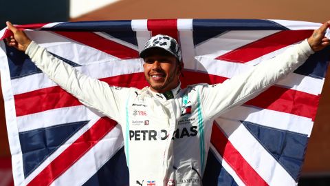 Britain's Lewis Hamilton celebrates in parc ferme after clinching his sixth Formula One world title.