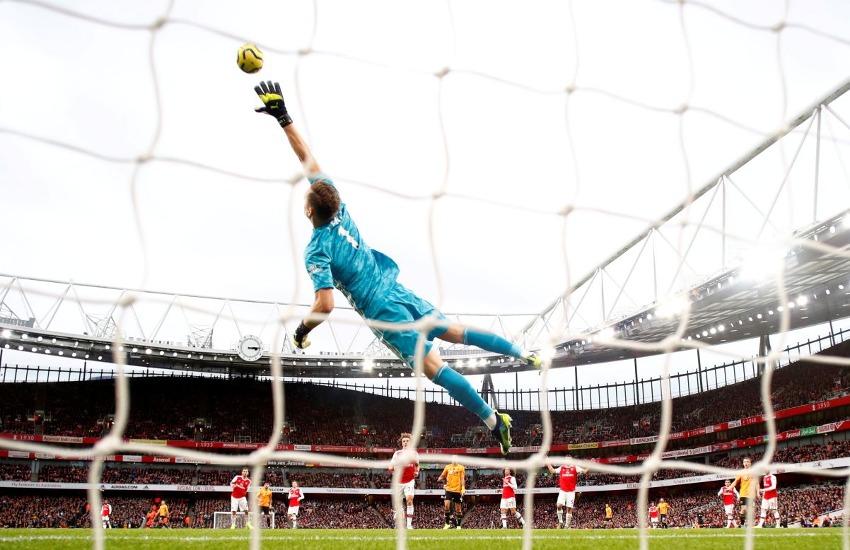 Arsenal goalie Bernd Leno attempts to block a shot during a match against the Wolverhampton Wanderers in Emirates Stadium in London on Saturday, November 2. The Arsenal and the Wolves tied 1-1.