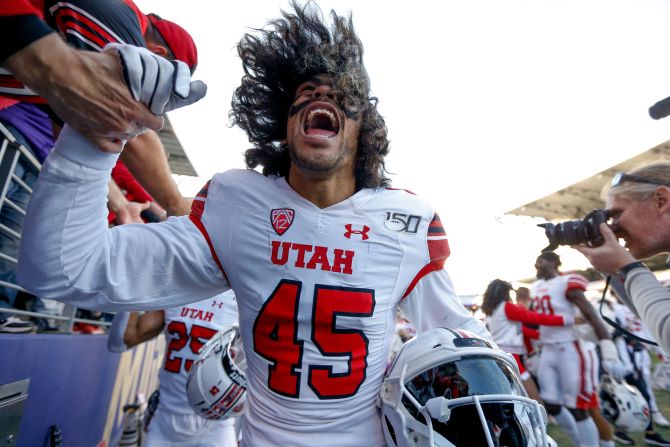 Utah Utes wide receiver Samson Nacua high-ﬁves fans after a win against the Washington Huskies at Husky Stadium in Seattle, Washington, on Saturday, November 2. 