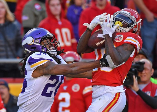 Kansas City Chiefs wide receiver Tyreek Hill catches a pass despite coverage from Minnesota Vikings cornerback Trae Waynes at Arrowhead Stadium in Kansas City, Missouri, on Sunday, November 3.