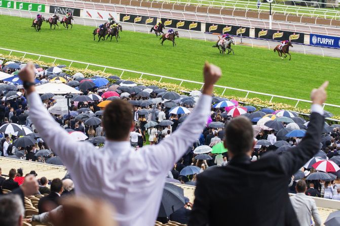 Damien Oliver riding Warning wins the seventh race of the Victory Derby at Flemington Racecourse in Melbourne, Australia, on Saturday, November 2. 