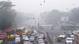 In this Sunday, Nov. 3, 2019, photo, vehicles wait at a crossing amidst morning smog in New Delhi, India. Authorities in New Delhi are restricting the use of private vehicles on the roads under an "odd-even" scheme based on license plates to control vehicular pollution as the national capital continues to gasp under toxic smog. (AP Photo/Manish Swarup)